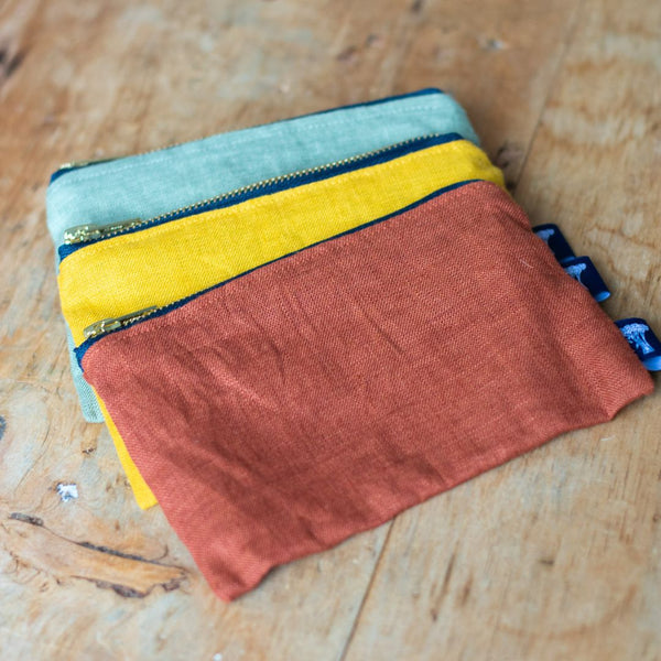 Choice of three Linen pouches, Sage Green, Mustard, or Rust wiith dark blue zips and dark blue velvet linings from Helen Round