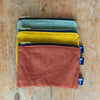 Small Linen Pouches with zip closure and dark blue velvet lining in Sage Green , Mustard or Rust Linen from Helen Round