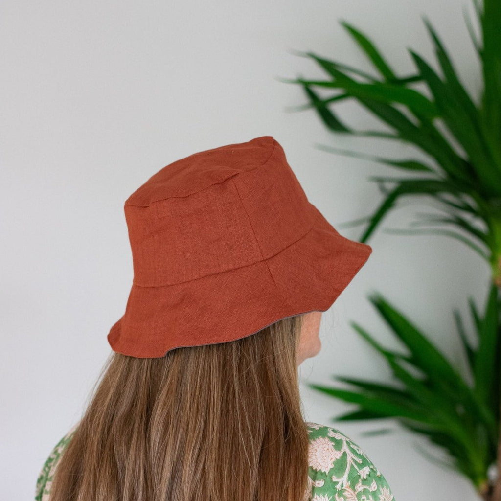 Reversible Rust Coloured Linen Bucket Hat with Grey Linen Lining from the Maker Collection by Helen ROund