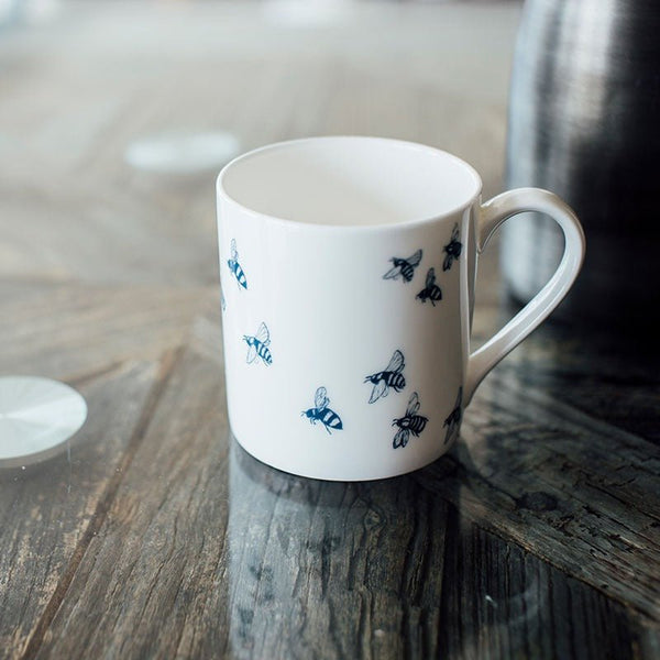 White Bee Mug made from fine bone china from the Honey Bee Collection by Helen Round. Dishwasher safe.
