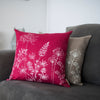 Floral cushion in raspberry red pure linen hand printed in white with the design from the Garden Collection by Helen Round