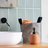 Large Linen Striped Storage Pot with Handles holding Towels in Bathroom by Helen Round