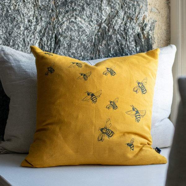 Mustard Linen Cushion with Bee Design from the Honey Bee Collection. Handprinted in blue  by Helen Round