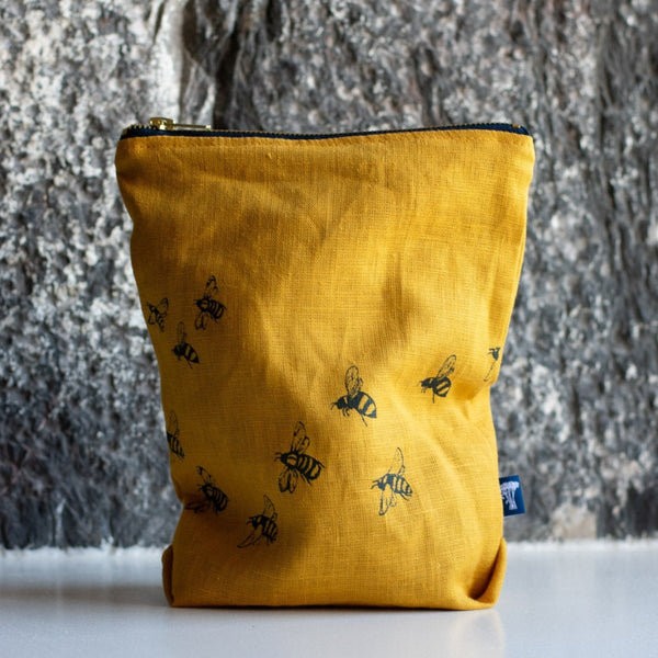 Mustard Linen Large Toiletry Bag decorated with Flying Bees from the Honey Bee Collection by Helen Round