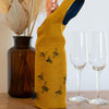 Bottle Bag with Fizz and Glasses in Mustard Linen from the Honey Bee Collection by Helen Round