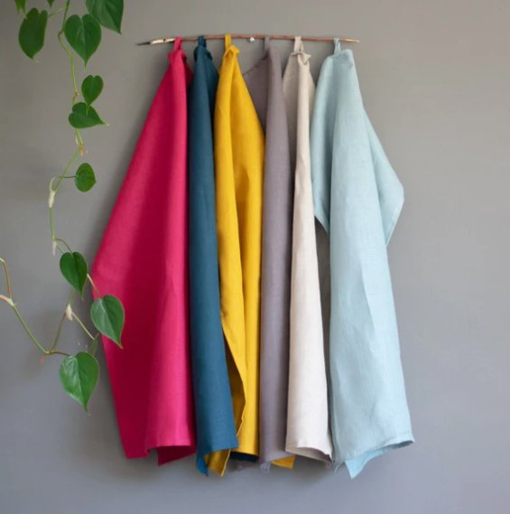 Pre-washed Plain Linen Tea Towel in Signature Colours Hanging from a hook from Helen Round