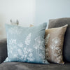 Two pure linen cushions from the Garden Collection, one in natural and one in duck egg blue. Handprinted in white by Helen Round