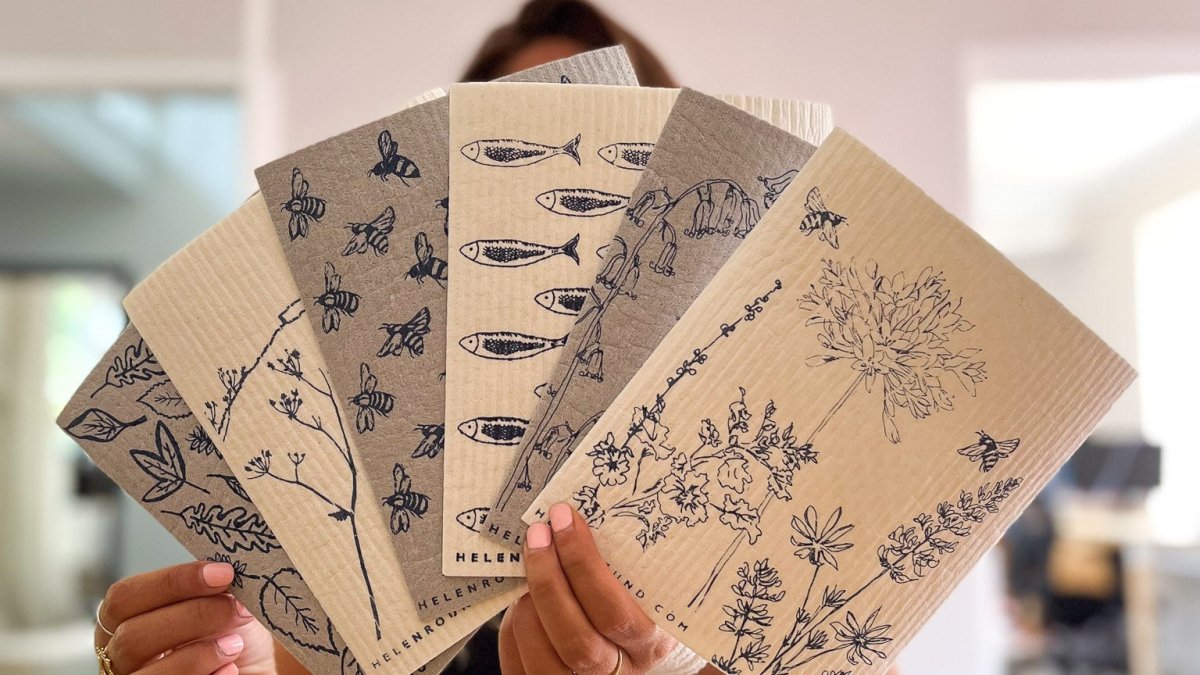 Range of Eco Kitchen Sponge Cloths held in a fan shape from Helen Round