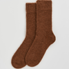 Pair of brown socks on a light gray background