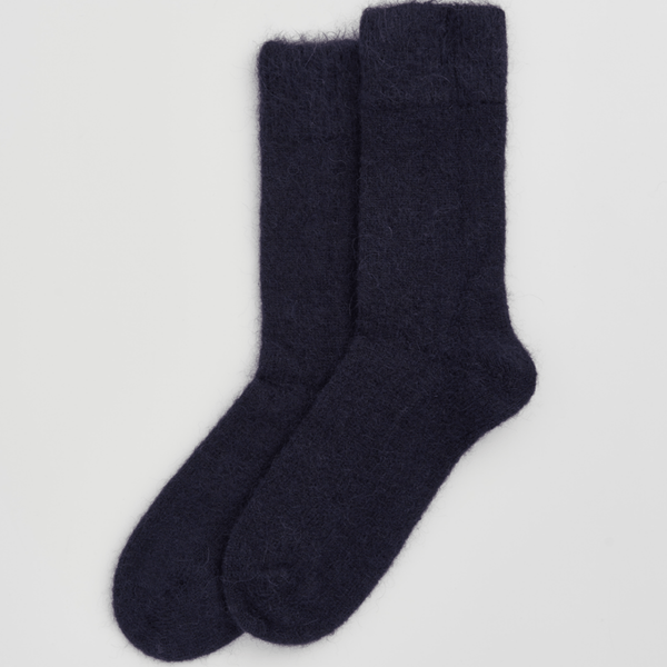 Pair of dark gray socks on a light gray background