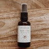 Moka daily calm spray bottle on a wooden surface