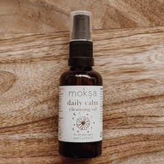 Moka daily calm spray bottle on a wooden surface