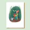 Greeting card with illustration of a person holding a potted plant in a garden setting. Sold by Helen Round