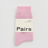 Pink sock with 'Pairs' label on a light gray background