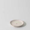 Small ceramic dish with a star design on a light gray background