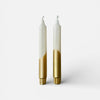 Two candles with white tops and gold bottoms on a white background sold by Helen round