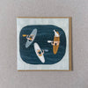 Illustrated card with people in kayaks and a dog on a rock, on a textured gray background, sold by Helen Round