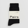 Black merino wool sock with 'Pairs' branding on a white background