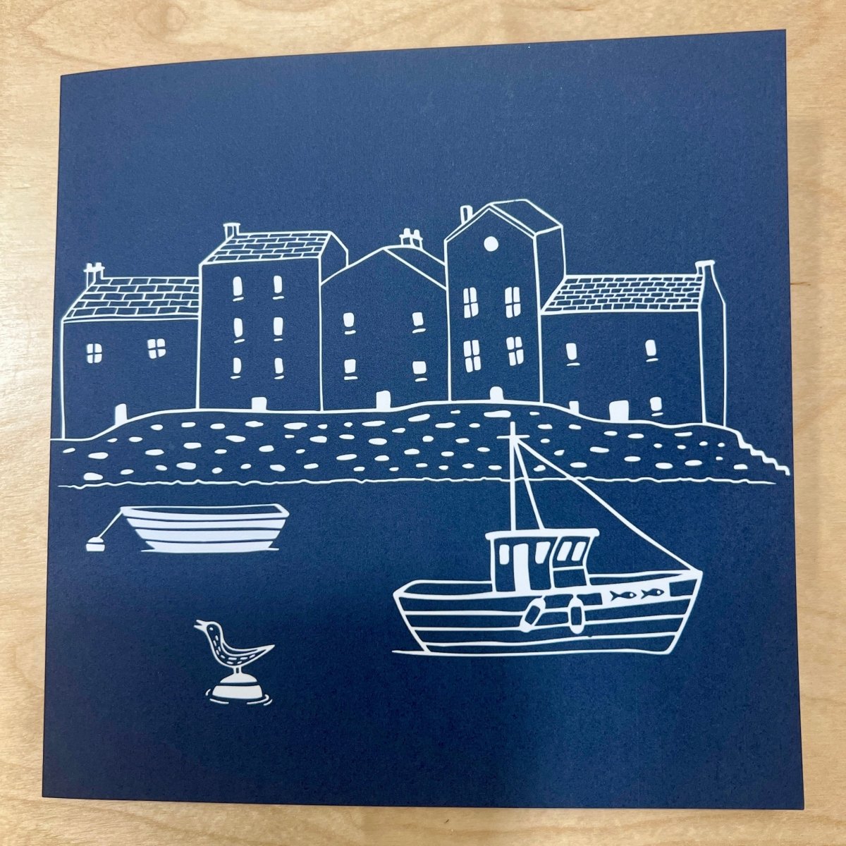 greetings card with Cornish cottages, fishing boat and bird