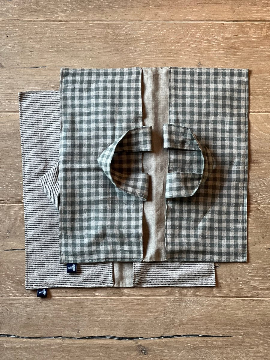 Sea Green Check Linen Pie Tote Bag lying on top of Striped Linen Pie Tote Bag both from Helen Round