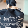 Navy Blue Linen Bread Bag tied with a cottton tie decorated with a screen printed coastal fishing village design from Helen Round.