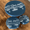 Three blue linen bowl covers with white coastal design on a wooden surface from Helen Round.