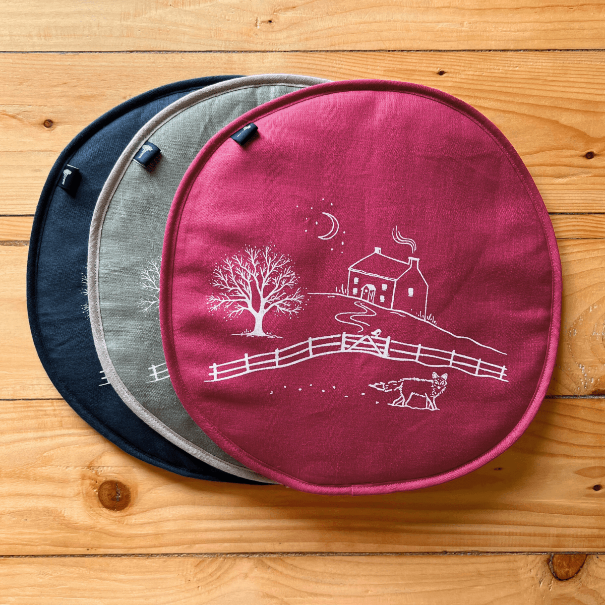 Collection of three aga pads in the from the Winter Fox Collection by Helen Round