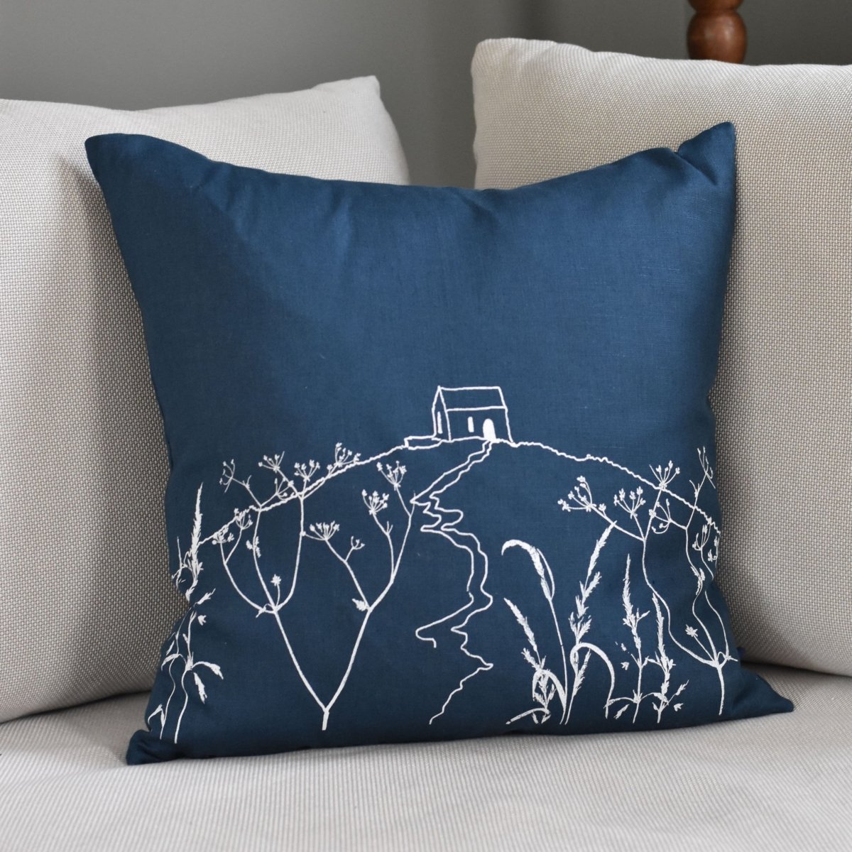 Navy Linen Rame Head Cushion with hand printed design by Helen Round