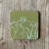 Green chartreuse coaster with Rame Head design on a wooden surface from Helen Round.