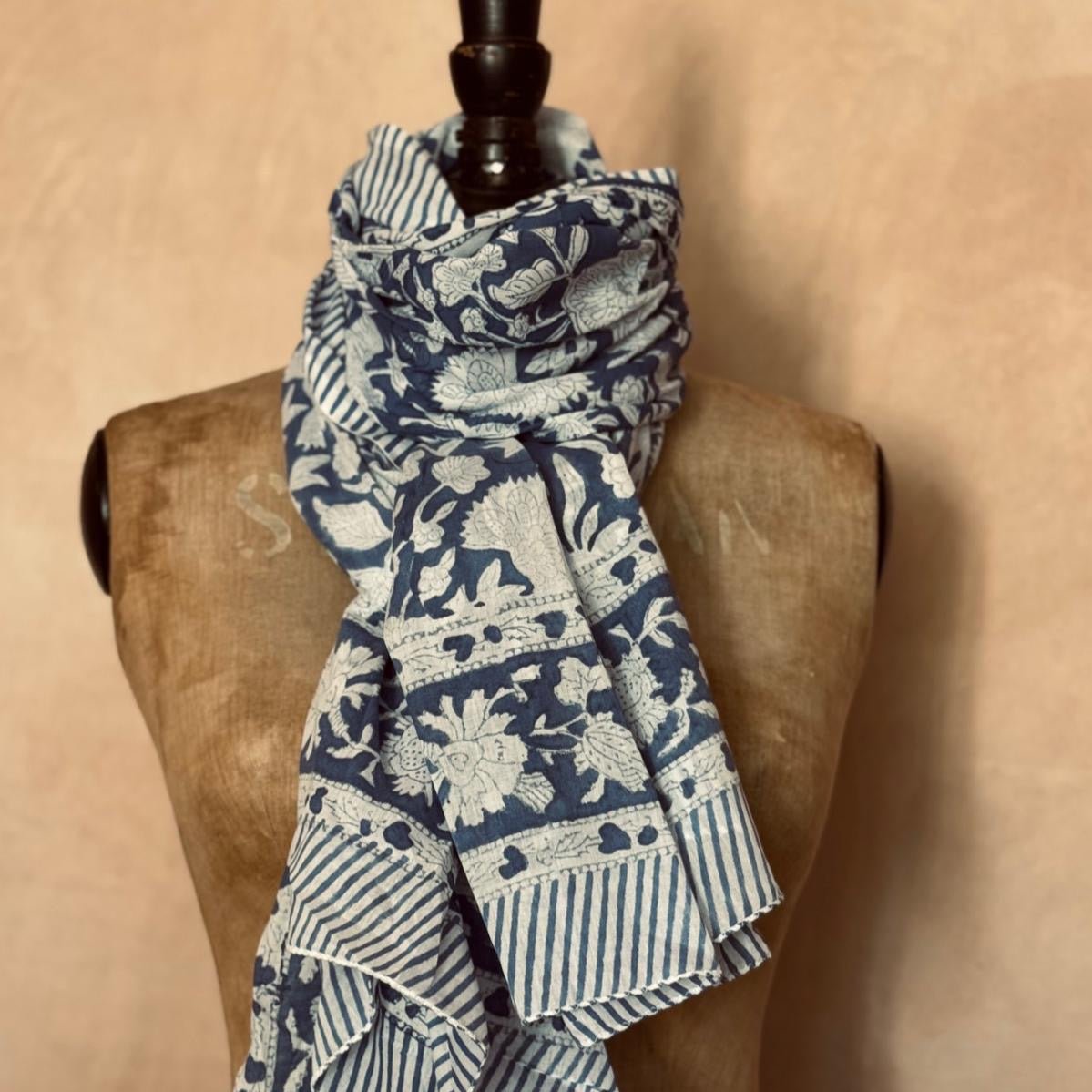 Blue and white patterned scarf on a mannequin against a beige background from Helen Round