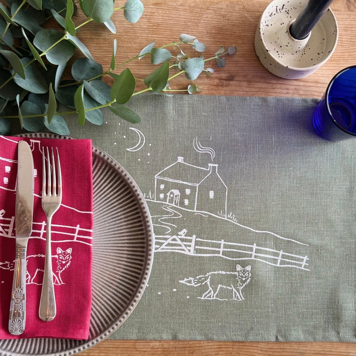 Sage Green Linen Placemat and Raspberry Red Linen Napkin from the Winter Fox Collection by Helen Round