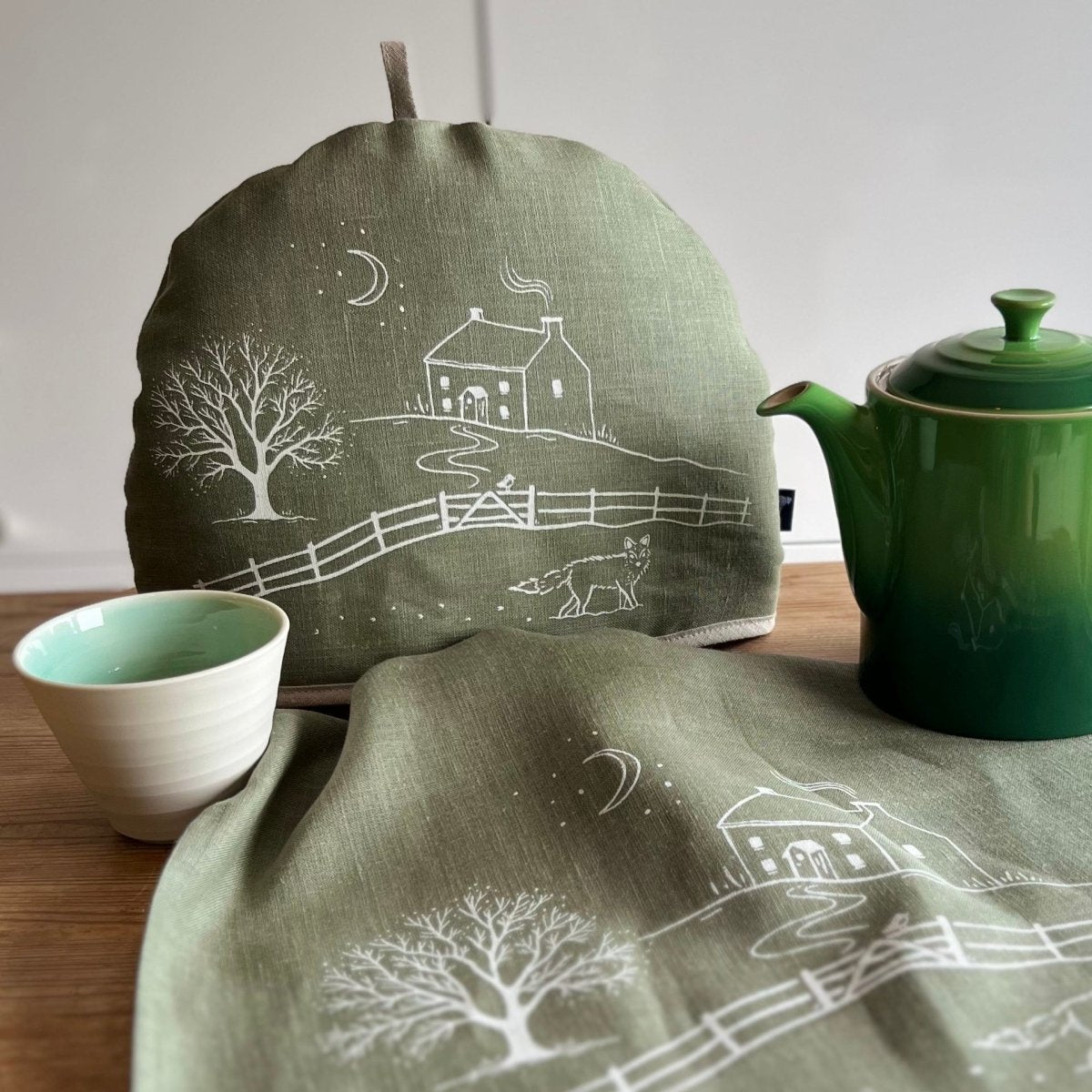 Winter Fox Collection Tea Cosy and Tea Towel in Sage Green Linen from Helen Round
