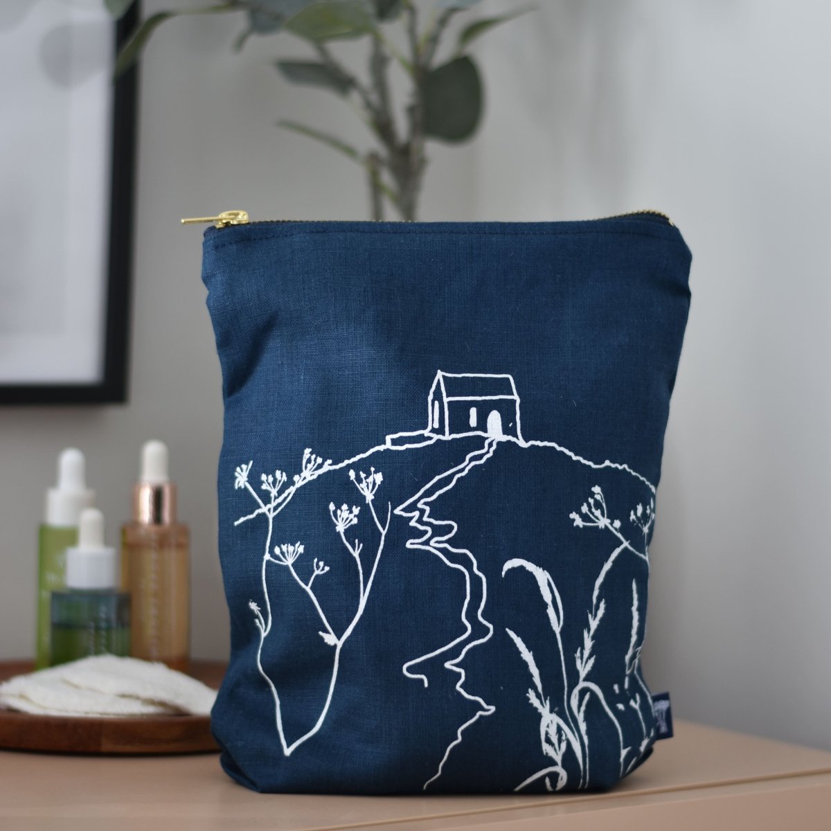 Navy Linen Toiletry Bag with Rame Head Design from Helen Round