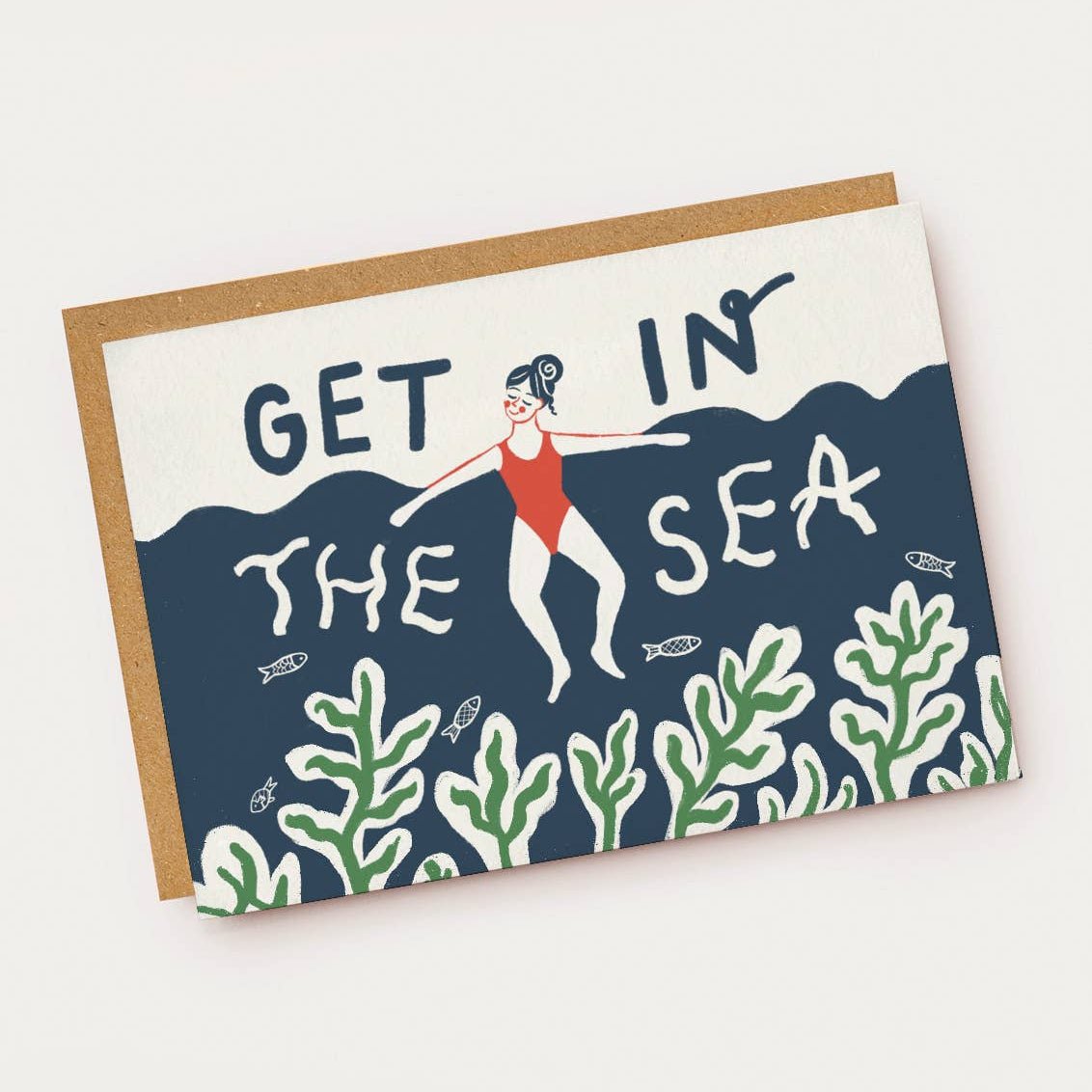 Greeting card with a design of a person in a swimsuit and text 'GET IN THE SEA' on a blue wave background. Sold by Helen Round