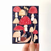 Illustrated card with smiling mushrooms and a snail on a white background sold by Helen Round