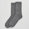 Pair of grey merino socks on a light grey background