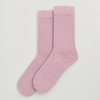 Pair of pink socks on a light gray background sold by Helen Round