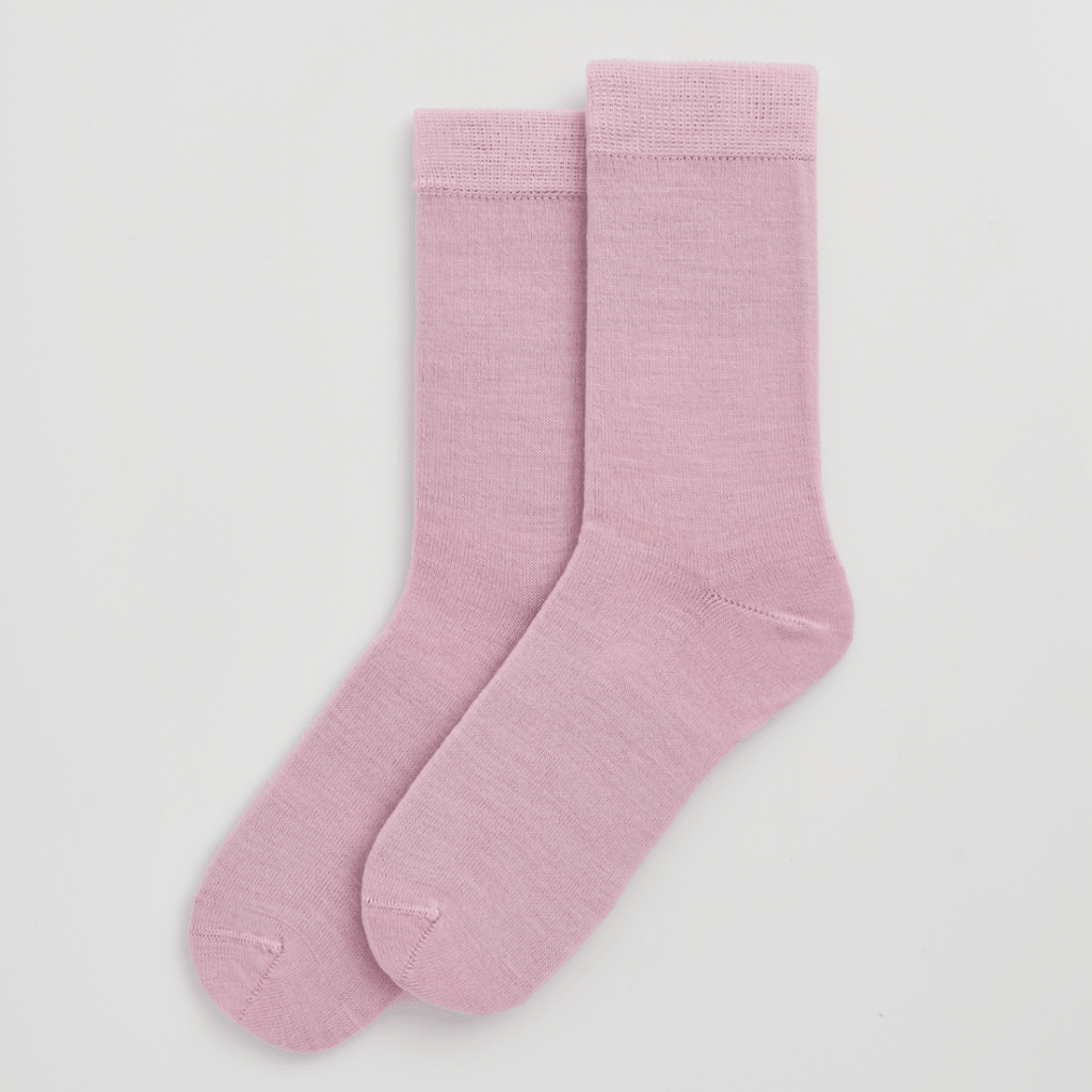 Pair of pink socks on a light gray background sold by Helen Round