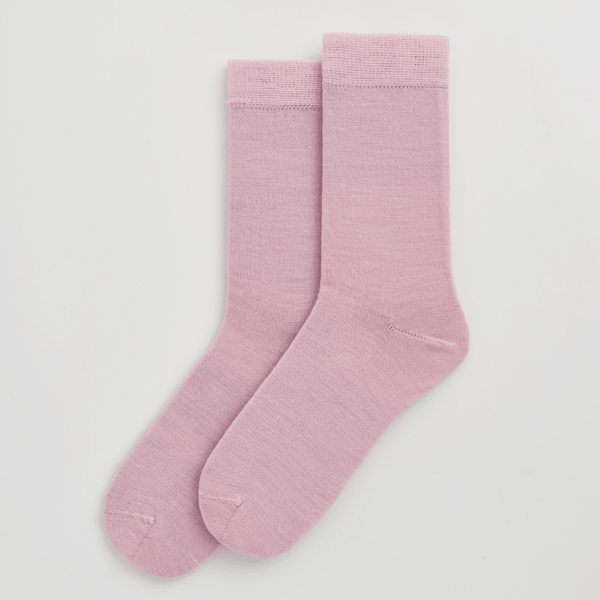 Pair of pink socks on a light gray background sold by Helen Round