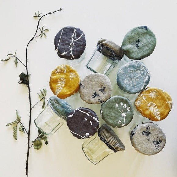 Empty jam jars with Reusable Linen Jam Jar Covers from our lovely customer Audrey