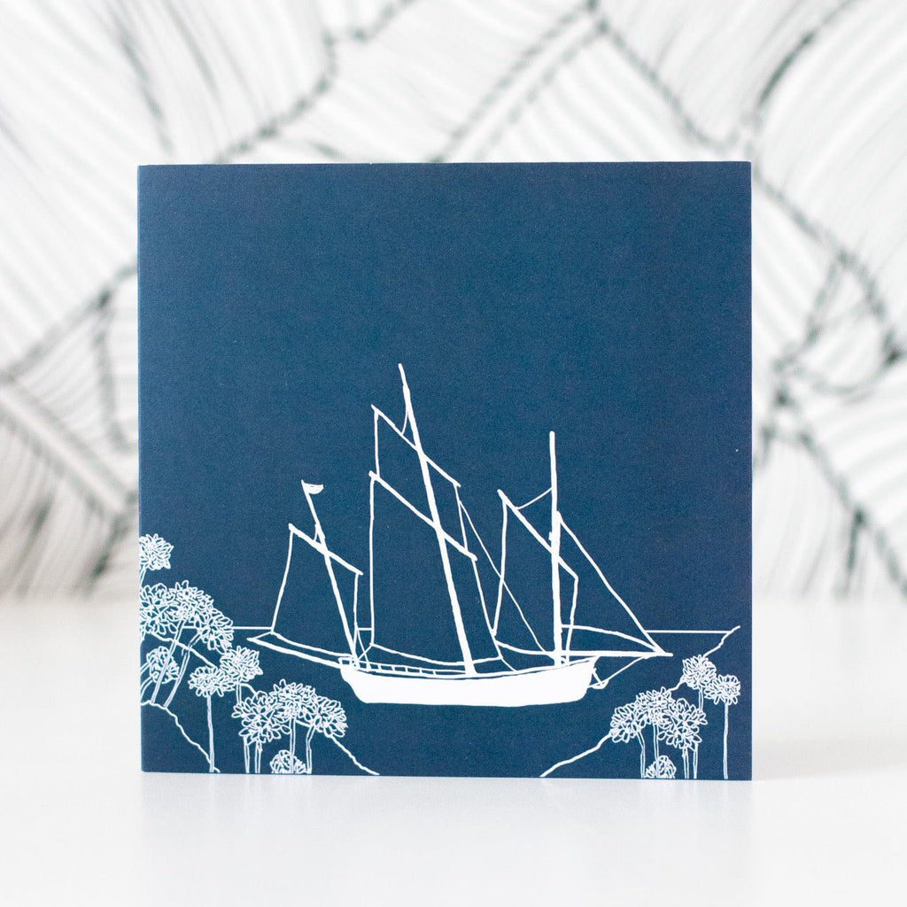 Coastal Greetings Card fully recyclable, chlorine free, FSC certified, inside left blank for your own message, Cornish lugger in white on a dark blue background