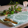sage green linen Christmas napkin with holly and ivy design
