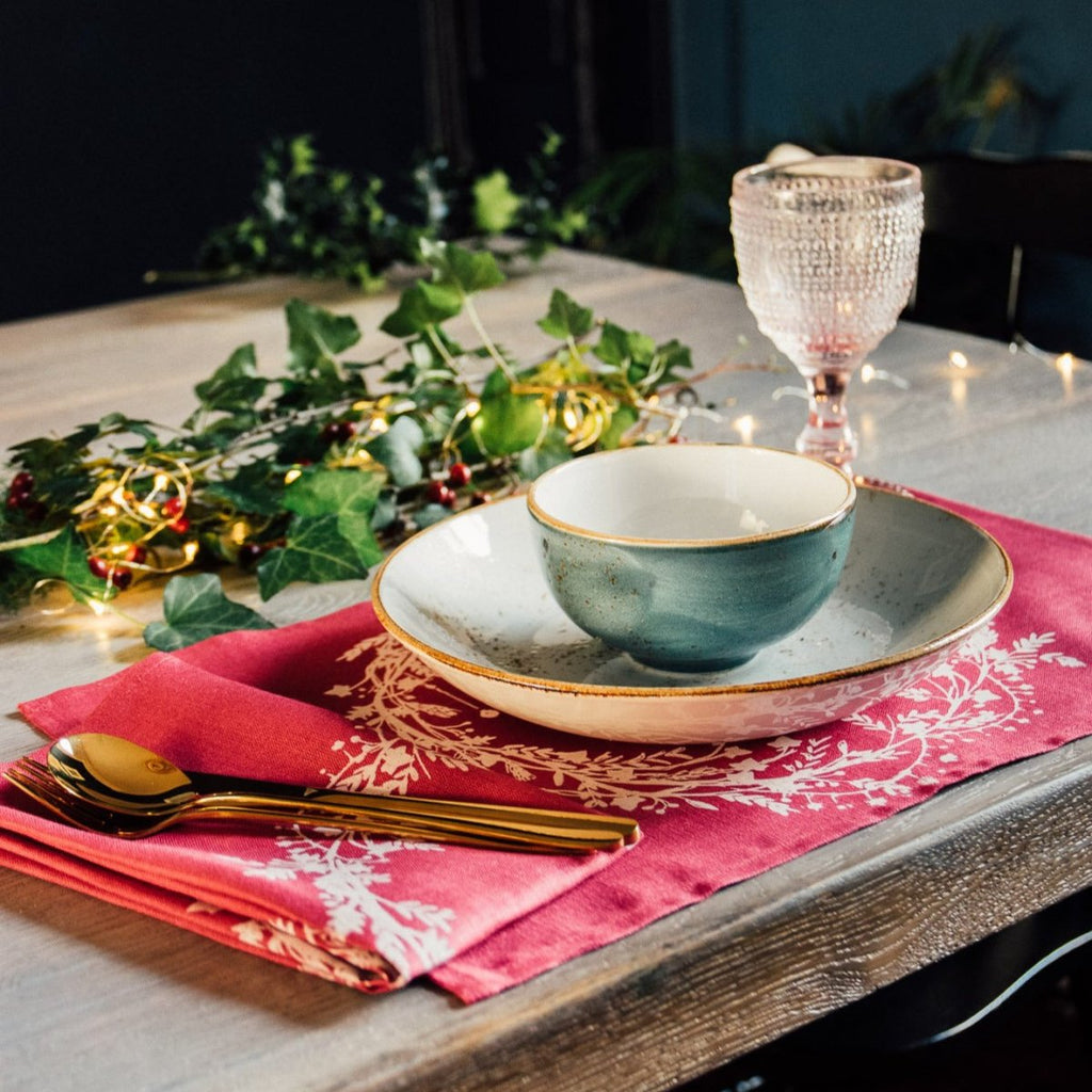 raspberry red linen Christmas napkin and placemat with holly and ivy design