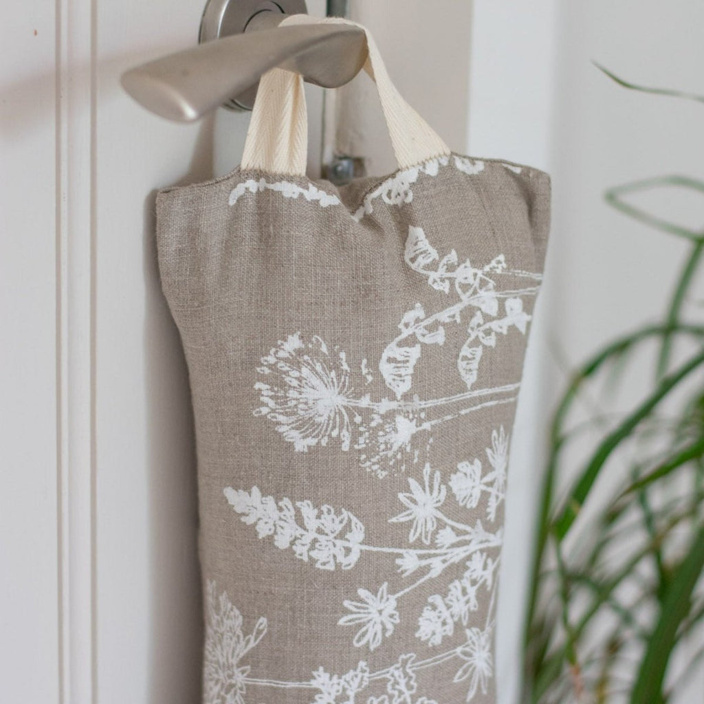 Close up of Natural Linen Draught Excluder with Cotton Hook, from the Garden Collection by Helen Round