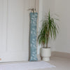 Duck Egg Blue Linen Draught Excluder with a floral design from the Garden Collection by Helen Round