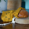 Bee Mustard Linen Bread Bag pictured on side  from the Honey Bee Collection by Helen Round