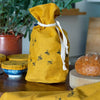 Bee Mustard Linen Bread Bag with Bowl Covers and Tea Towel, all from the Honey Bee Collection by Helen Round
