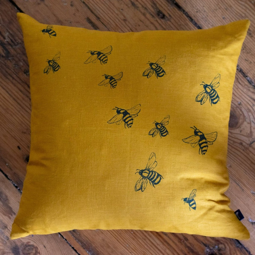 Mustard Linen Cushion with Bee Design from the Honey Bee Collection. Handprinted in blue by Helen Round