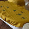 Mustard Linen Banneton Cover with Bee Design from the Honey Bee Collection by Helen Round