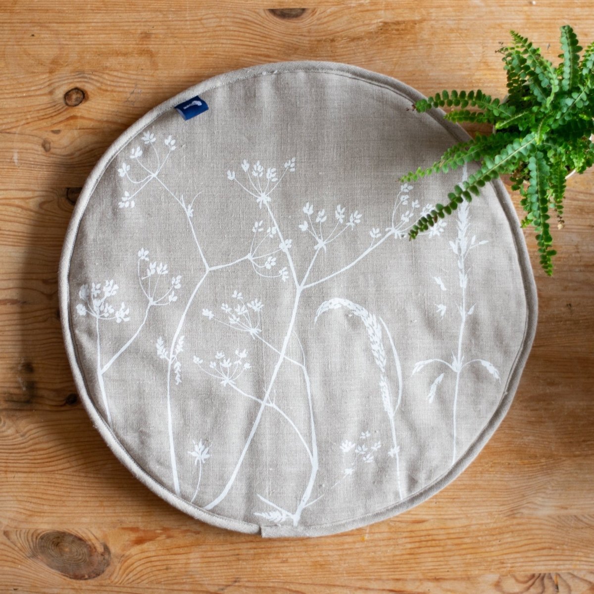 Aga pad with hedgerow grass design in natural linen